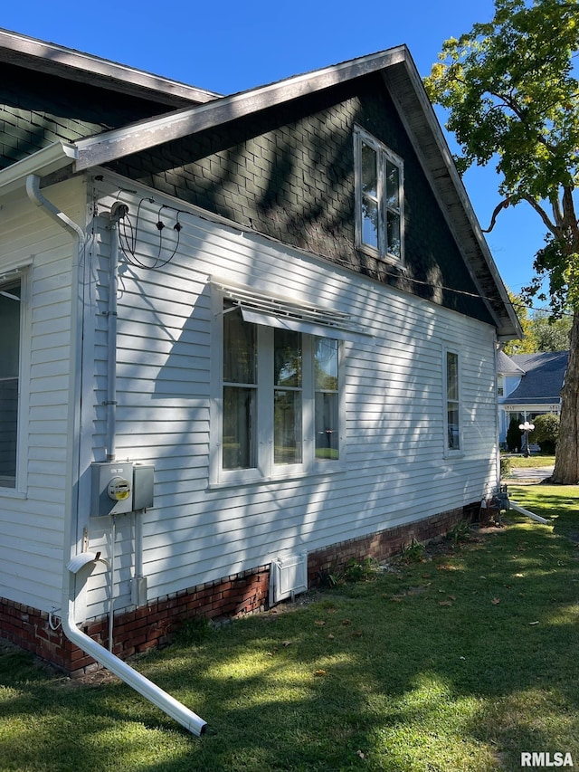 view of home's exterior featuring a lawn