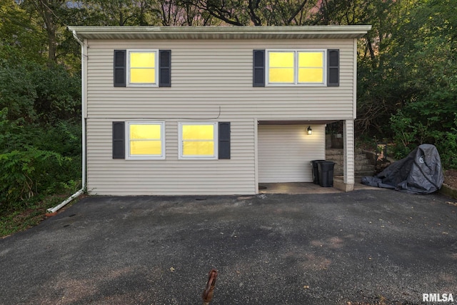 view of side of home with a garage