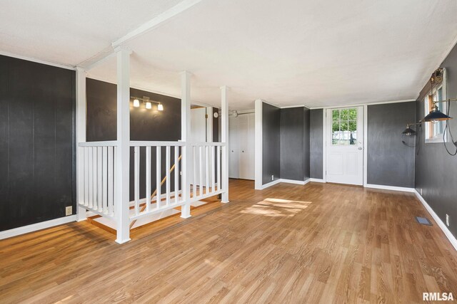 unfurnished room with hardwood / wood-style floors