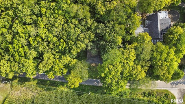 birds eye view of property with a rural view