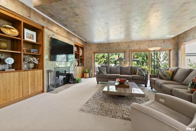 200 W Ravinwoods Rd, Peoria, IL 61615 - carpeted living room with a tile fireplace