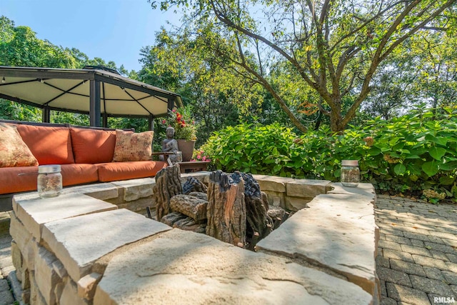 view of patio with a gazebo and an outdoor living space