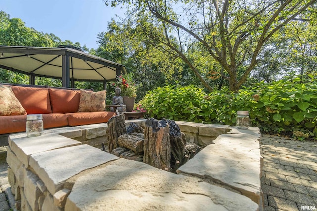 200 W Ravinwoods Rd, Peoria, IL 61615 - view of patio with a gazebo and an outdoor hangout area