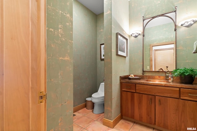 bathroom with vanity, tile patterned flooring, and toilet