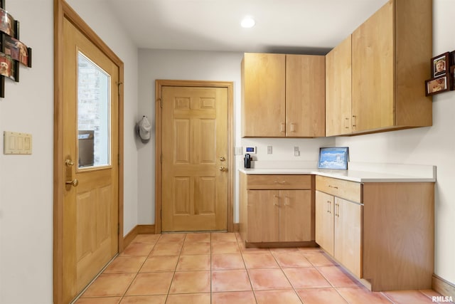 200 W Ravinwoods Rd, Peoria, IL 61615 - kitchen featuring light countertops, light brown cabinetry, light tile patterned flooring, recessed lighting, and baseboards