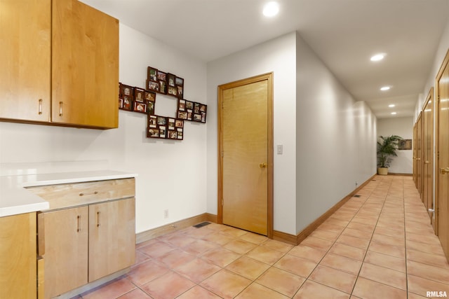 200 W Ravinwoods Rd, Peoria, IL 61615 - hall featuring recessed lighting, light tile patterned floors, and baseboards