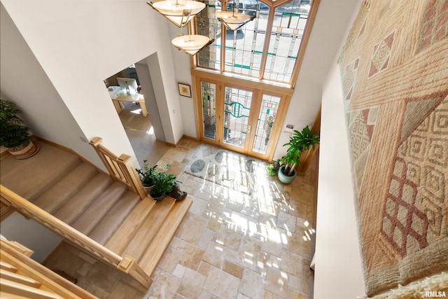 entryway with a towering ceiling