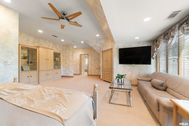 bedroom featuring ceiling fan and light colored carpet