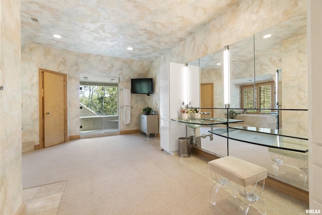 200 W Ravinwoods Rd, Peoria, IL 61615 - hallway featuring plenty of natural light, recessed lighting, baseboards, and carpet flooring