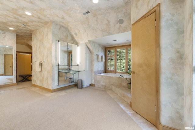 200 W Ravinwoods Rd, Peoria, IL 61615 - bathroom with a bath, recessed lighting, and vaulted ceiling