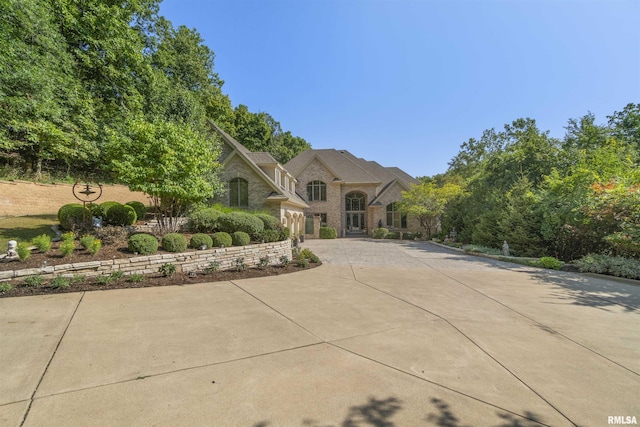 200 W Ravinwoods Rd, Peoria, IL 61615 - french country style house with curved driveway and stone siding
