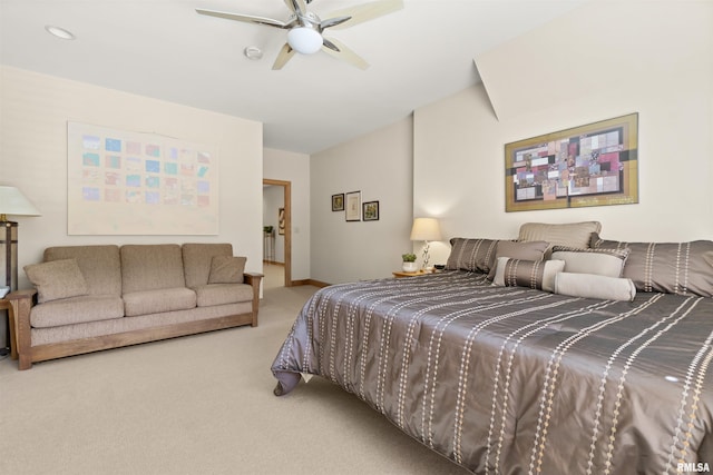 200 W Ravinwoods Rd, Peoria, IL 61615 - carpeted bedroom with vaulted ceiling, baseboards, and a ceiling fan