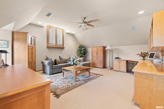 carpeted living room with lofted ceiling and ceiling fan