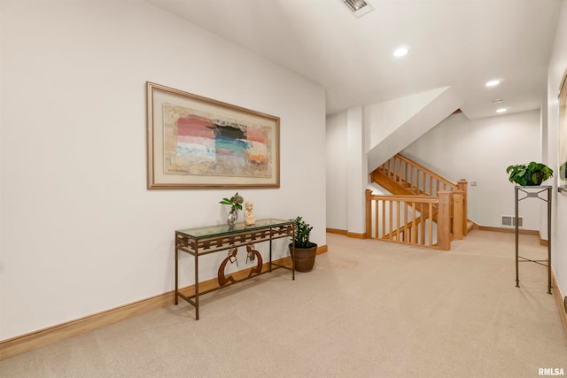 living area with light carpet