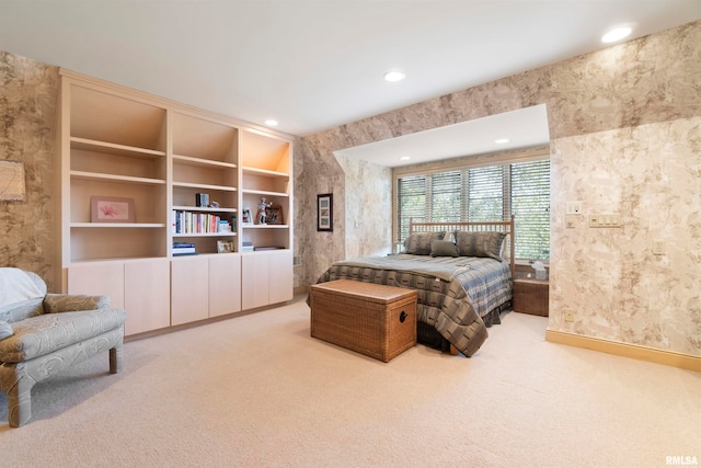 bedroom featuring light carpet