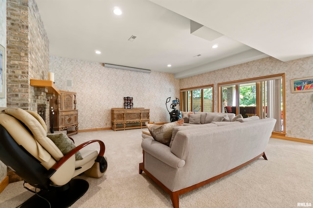 carpeted living room featuring a fireplace