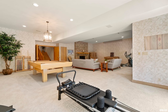 interior space with carpet, a fireplace, and an inviting chandelier