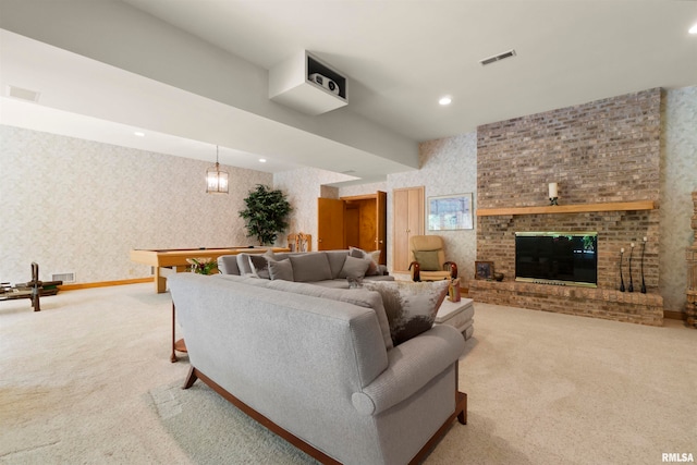 living room with light colored carpet and a brick fireplace