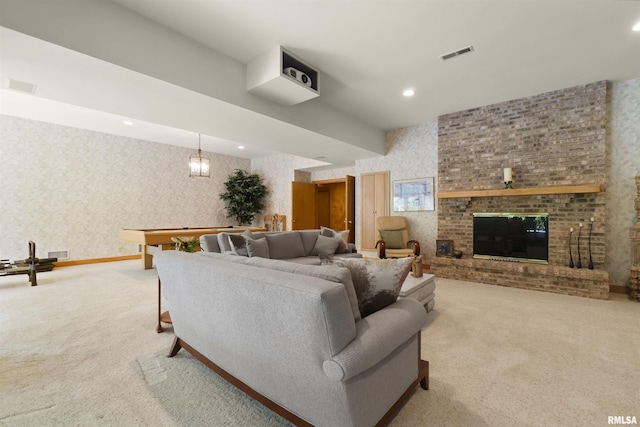 200 W Ravinwoods Rd, Peoria, IL 61615 - living room with light colored carpet, wallpapered walls, a brick fireplace, and recessed lighting