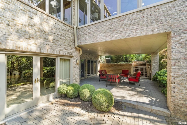 200 W Ravinwoods Rd, Peoria, IL 61615 - view of patio featuring an outdoor hangout area