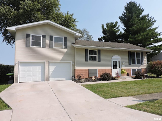 view of front of property featuring a garage and a front lawn