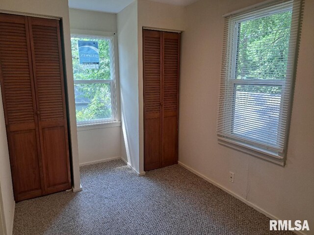 unfurnished bedroom with carpet