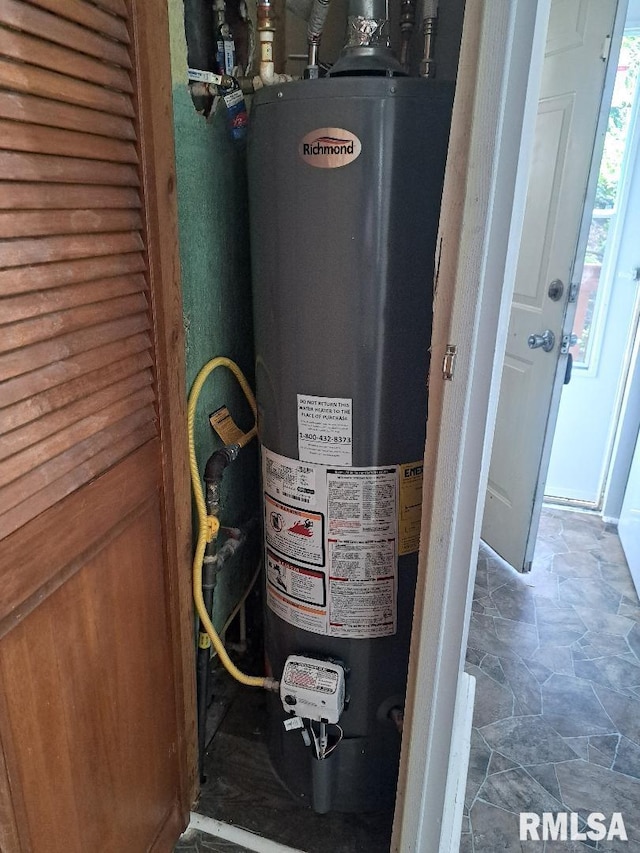 utility room with gas water heater