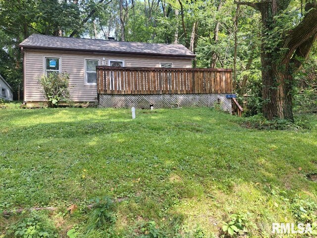 view of yard with a wooden deck