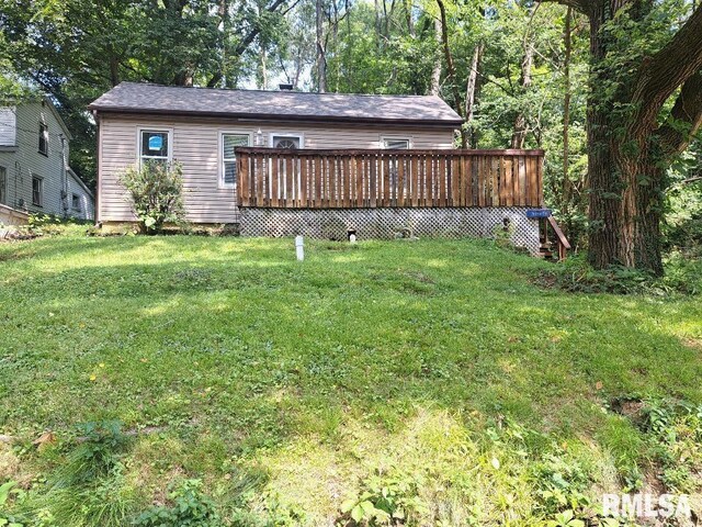 view of yard featuring a wooden deck