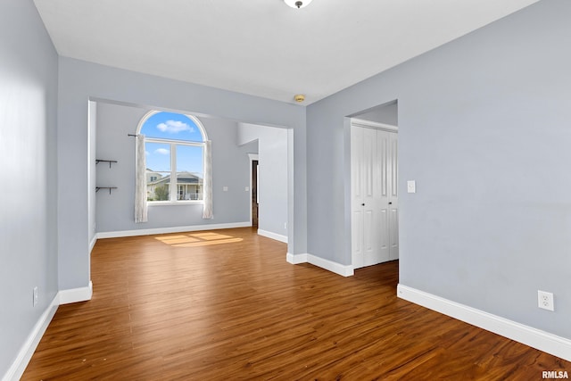 empty room featuring hardwood / wood-style flooring