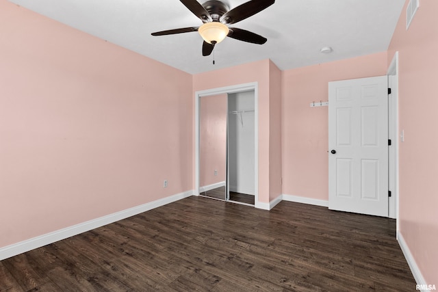 unfurnished bedroom featuring ceiling fan, a closet, and dark hardwood / wood-style floors