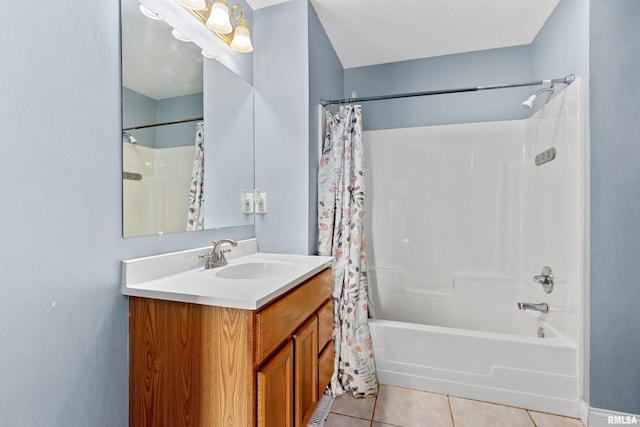 bathroom featuring tile patterned flooring, shower / tub combo, and vanity