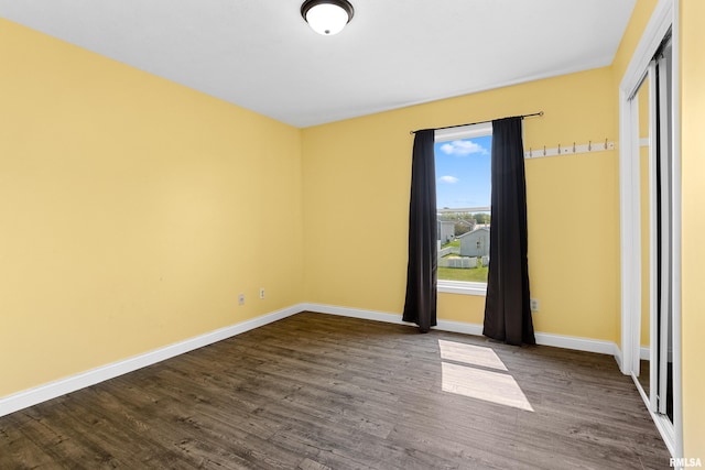 empty room featuring hardwood / wood-style flooring