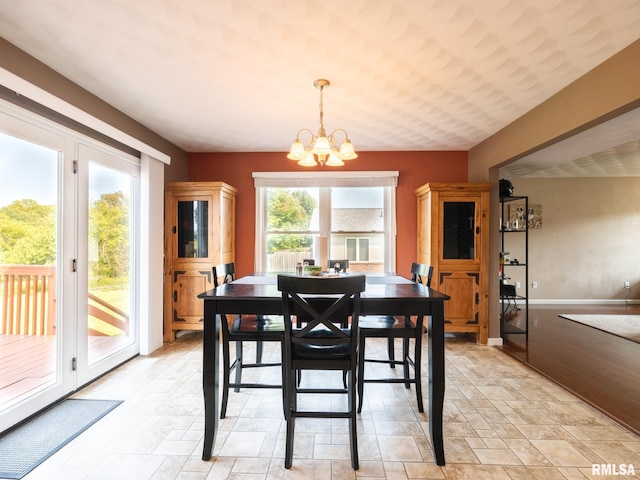 dining area with a notable chandelier