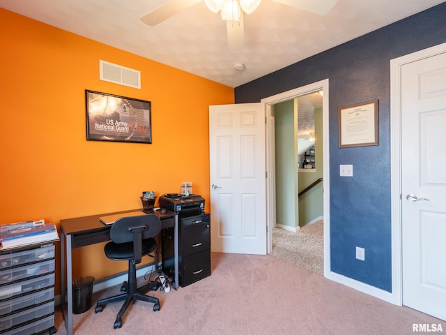 carpeted office featuring ceiling fan