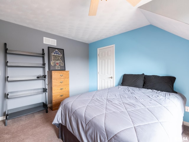 bedroom featuring lofted ceiling, ceiling fan, and carpet floors