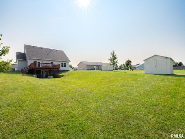 view of yard with a storage shed and a deck