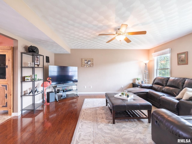 living room featuring hardwood / wood-style flooring and ceiling fan