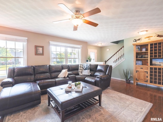 living room with ceiling fan and hardwood / wood-style flooring