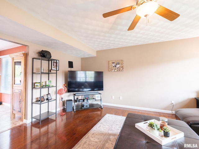 living room with hardwood / wood-style floors and ceiling fan