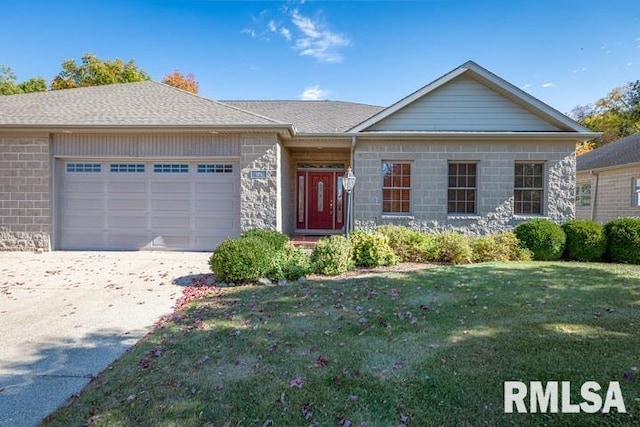 ranch-style home with a front yard and a garage