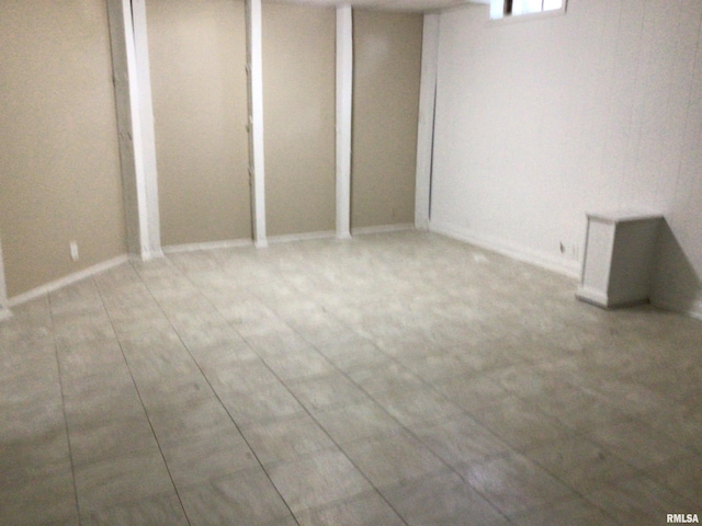 basement featuring tile patterned flooring