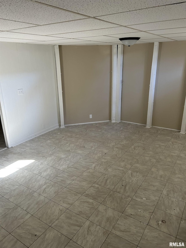 spare room featuring a paneled ceiling