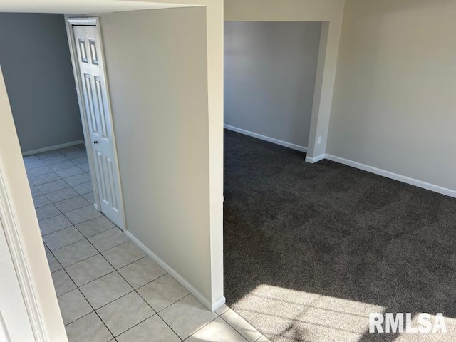 hall featuring light tile patterned flooring