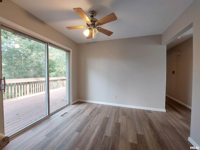 spare room featuring ceiling fan and hardwood / wood-style flooring