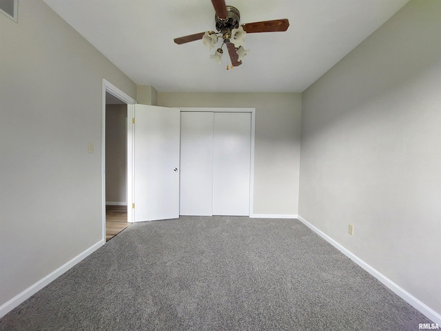 unfurnished bedroom featuring carpet flooring, ceiling fan, and a closet