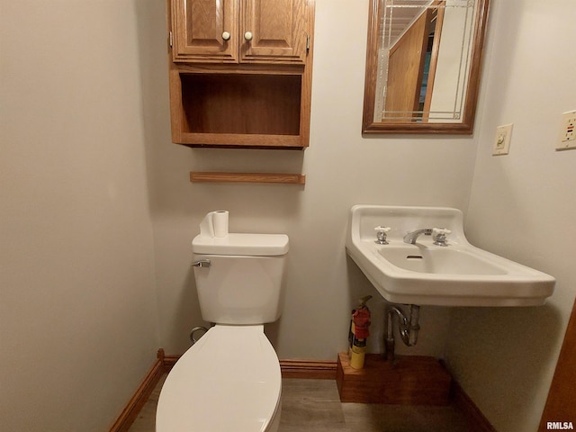 bathroom featuring sink and toilet