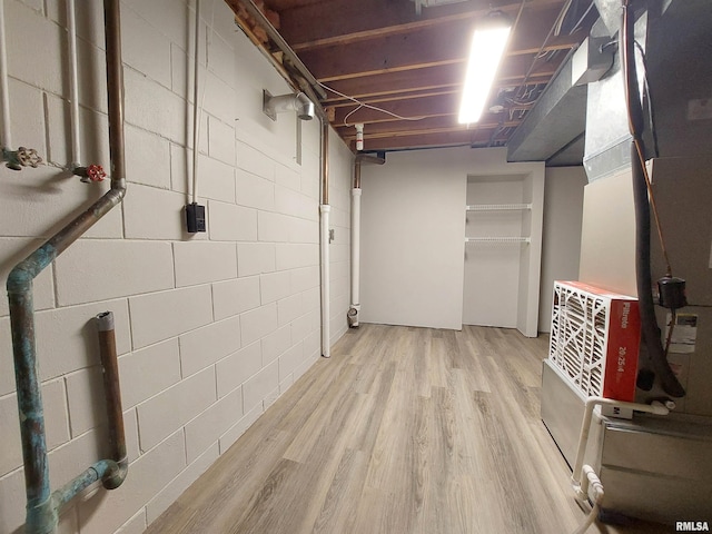 basement featuring light hardwood / wood-style flooring