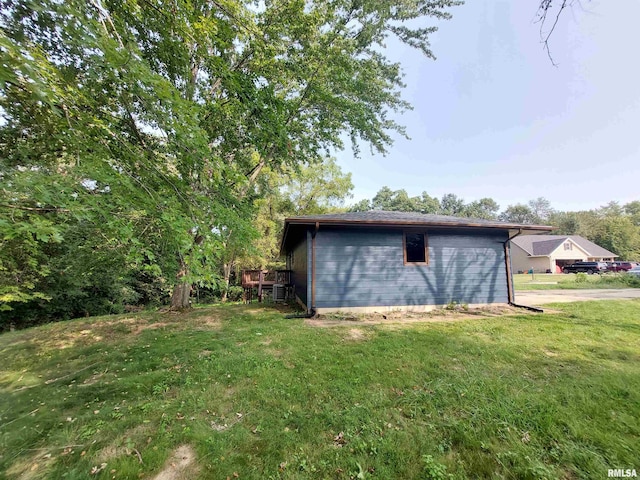 view of side of property with a lawn