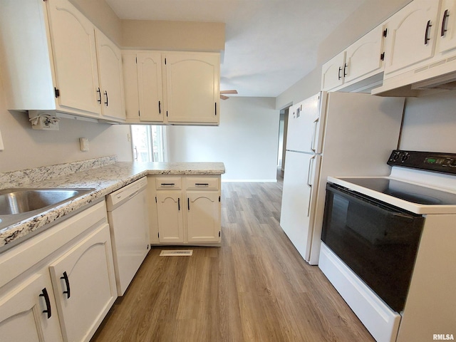 kitchen featuring light hardwood / wood-style flooring, white cabinets, white appliances, and kitchen peninsula